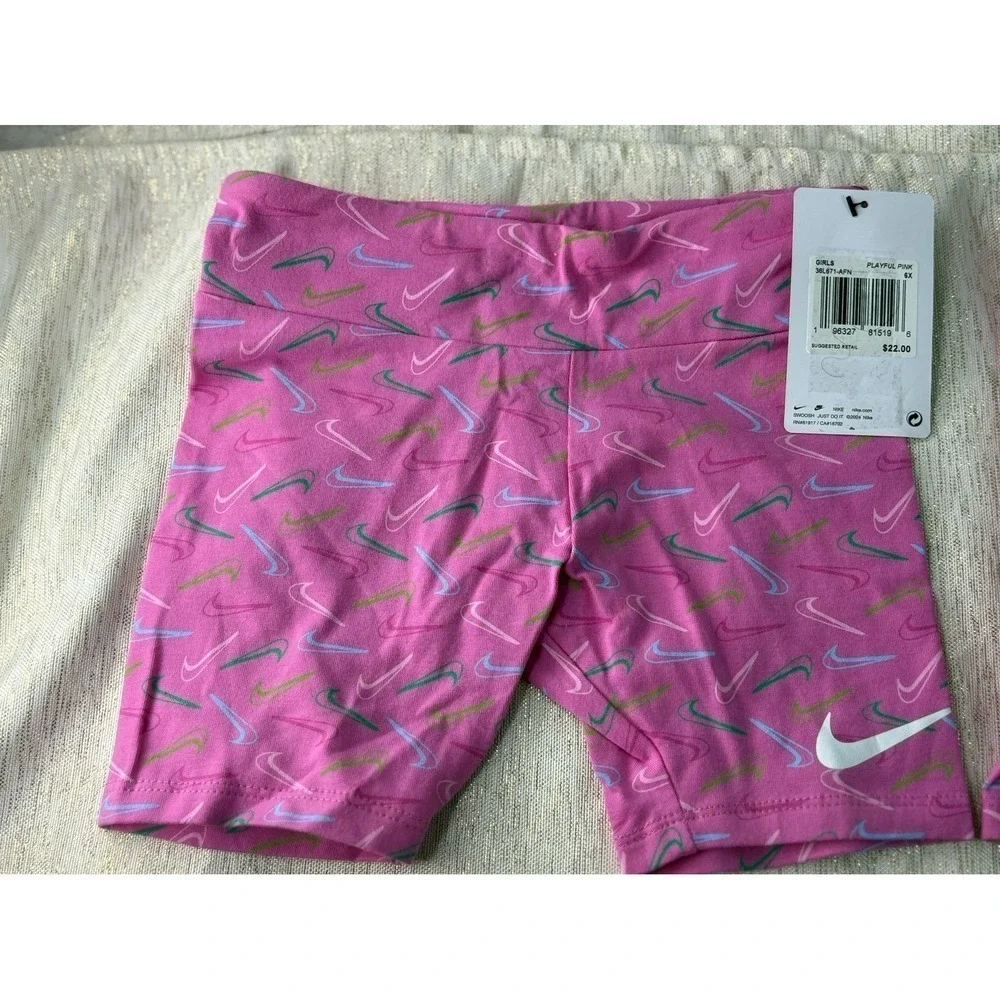 Three pairs of pink Nike biker shorts, size 6X and 6